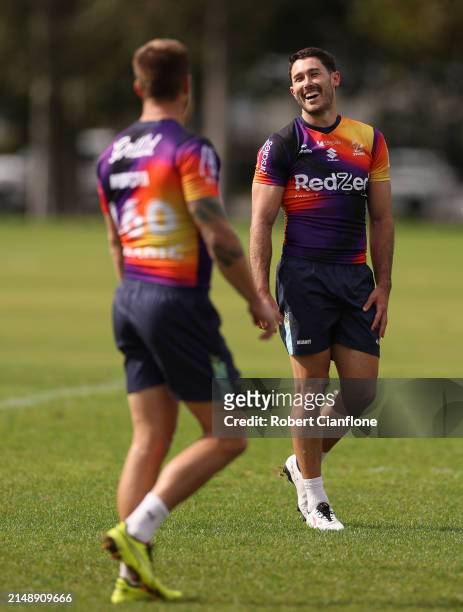 Nick Meaney and Cameron Munster of the Storm are seen during a Melbourne Storm NRL training session at Gosch's Paddock on April 17, 2024 in...