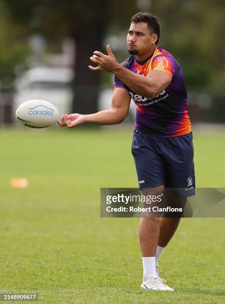 Eliesa Katoa of the Storm passes the ball during a Melbourne Storm NRL training session at Gosch's Paddock on April 17, 2024 in Melbourne, Australia.