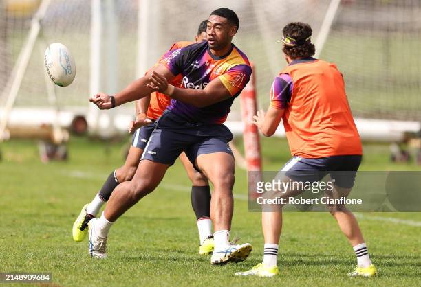 Lazarus Vaalepu of the Storm passes the ball during a Melbourne Storm NRL training session at Gosch's Paddock on April 17, 2024 in Melbourne,...