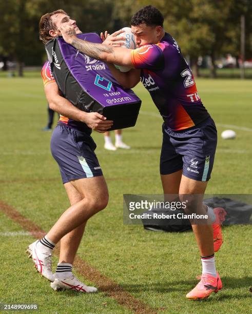 Alec MacDonald and Joe Chan of the Storm are seen during a Melbourne Storm NRL training session at Gosch's Paddock on April 17, 2024 in Melbourne,...