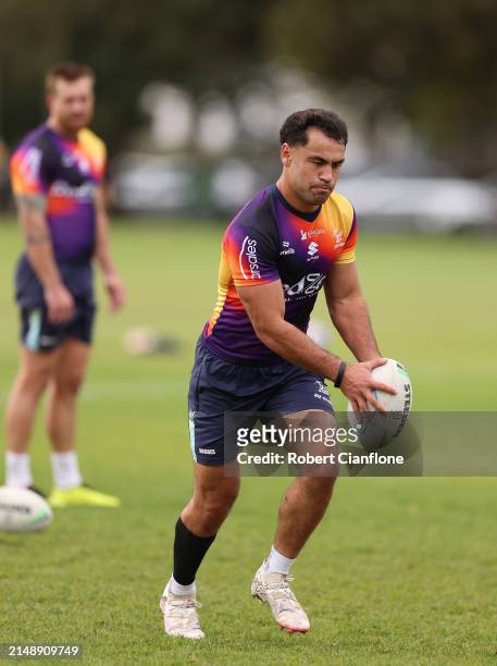 Jahrome Hughes of the Storm controls the ball during a Melbourne Storm NRL training session at Gosch's Paddock on April 17, 2024 in Melbourne,...