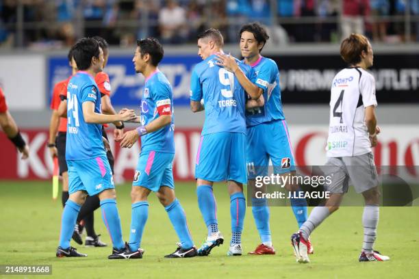 Sagan Tosu players celebrate the team's 3-0 victory in the J.League J1 match between Sagan Tosu and Gamba Osaka at Best Amenity Stadium on August 26,...