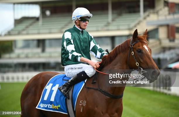Michael Dee riding Rich Dottie after winning race 1, the Sportsbet Fast Form Handicap during Melbourne Racing at Caulfield Heath Racecourse on April...