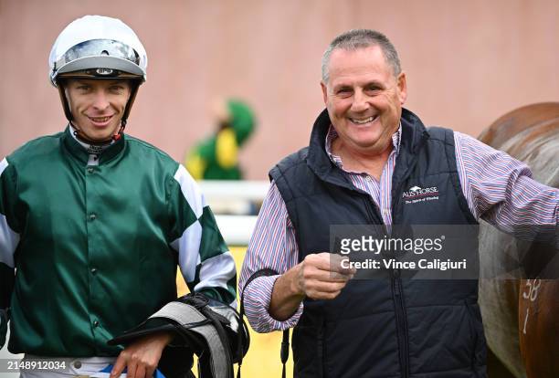 Michael Dee poses with trainer Grahame Begg after riding Rich Dottie after winning race 1, the Sportsbet Fast Form Handicap during Melbourne Racing...