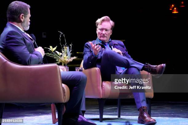 Nick Offerman and Conan O'Brien speak onstage during the Photo Call For Los Angeles premiere of "Conan O'Brien Must Go" at Avalon Hollywood & Bardot...