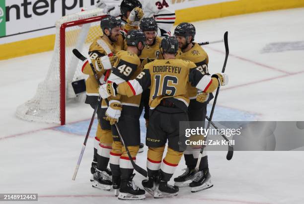 Brayden McNabb of the Vegas Golden Knights celebrates with teammates after scoring a goal during the second period against the Chicago Blackhawks at...