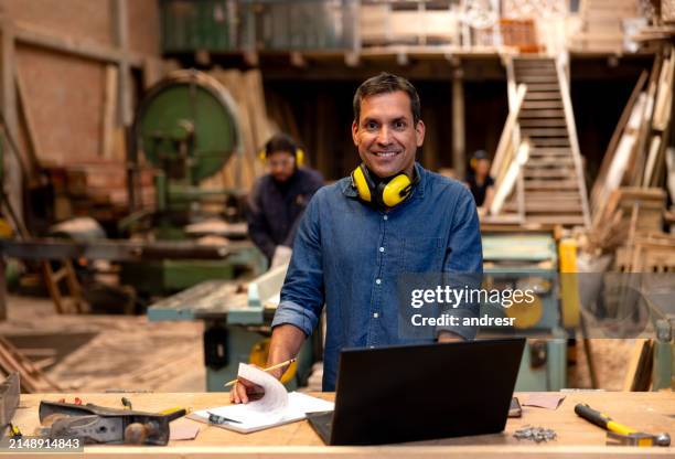 business manager working at a wood factory - lumberyard stock pictures, royalty-free photos & images