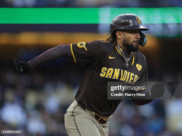 Fernando Tatis Jr. #23 of the San Diego Padres reacts to his single during a 6-3 win over the Los Angeles Dodgers at Dodger Stadium on April 14, 2024...