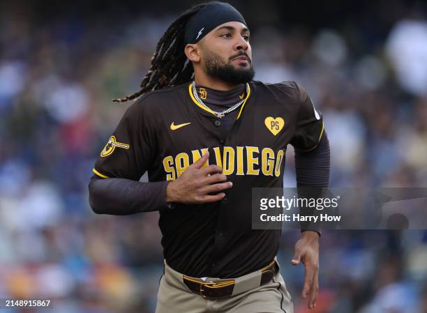 Fernando Tatis Jr. #23 of the San Diego Padres reacts after a Manny Machado solo homerun during a 6-3 win over the Los Angeles Dodgers at Dodger...