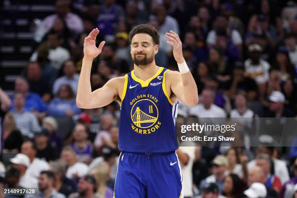 Klay Thompson of the Golden State Warriors reacts after missing a shot against the Sacramento Kings in the second half during the Play-In Tournament...