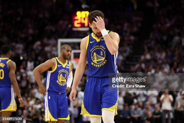 Klay Thompson of the Golden State Warriors reacts after missing a shot against the Sacramento Kings in the second half during the Play-In Tournament...