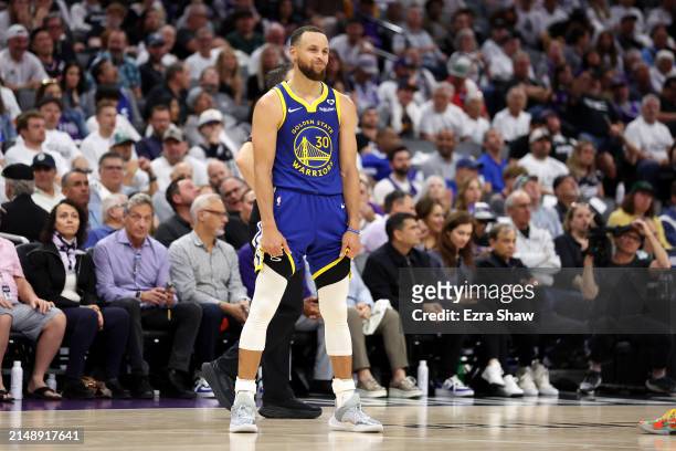 Stephen Curry of the Golden State Warriors stands on the court during the end of the the second half of their loss to the Sacramento Kings during the...