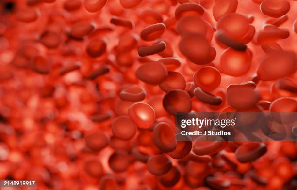closeup bloodcells with one glowing - red blood cell stock pictures, royalty-free photos & images