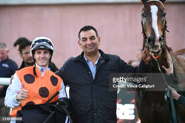 Beau Mertens poses with trainer Julius Sandhu after riding Excess to win Race 4, the Whisky, Wine & Fire Handicap, during Melbourne Racing at...