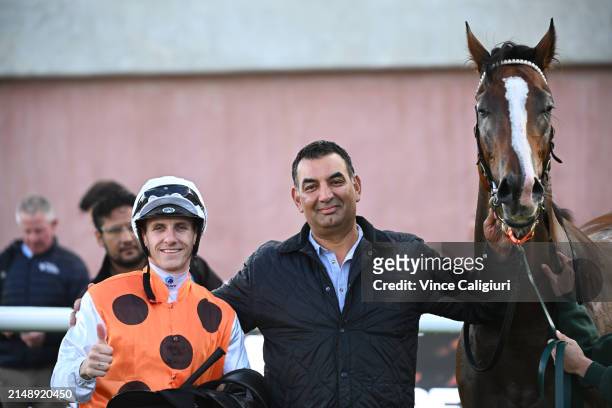 Beau Mertens poses with trainer Julius Sandhu after riding Excess to win Race 4, the Whisky, Wine & Fire Handicap, during Melbourne Racing at...