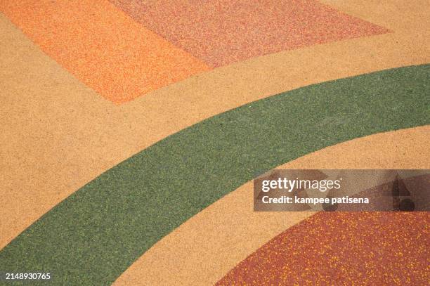 colorful rubber mat background on a children's playground - característica de la tierra fotografías e imágenes de stock