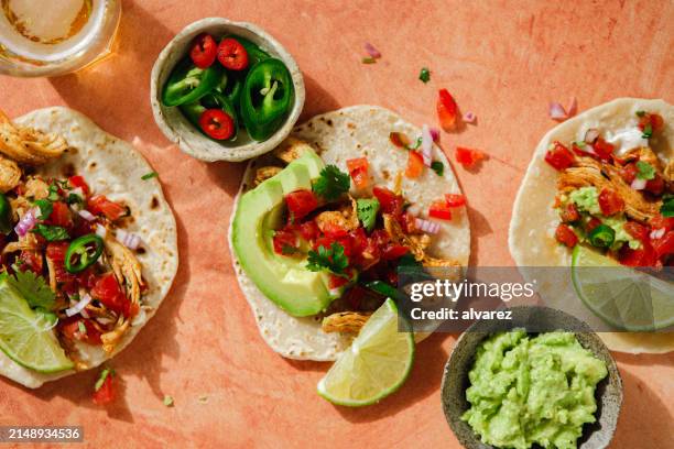 delicious stuffed tortillas with avocado guacamole on the table - condiment stock pictures, royalty-free photos & images