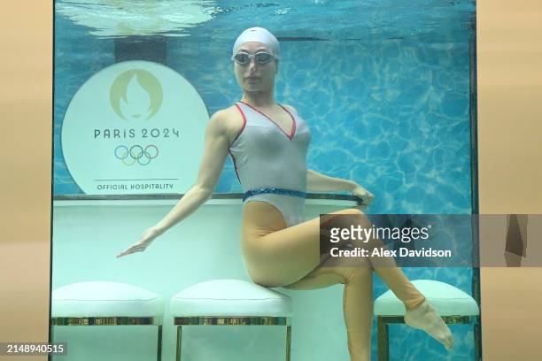 Synchronized swimmer is seen performing a routine as Dame Laura Kenny attends the synchronized swimming event by On Location celebrating 100 days...