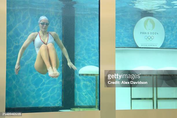 Synchronized swimmer is seen performing a routine as Dame Laura Kenny attends the synchronized swimming event by On Location celebrating 100 days...