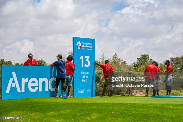 Ground staff works on the course prior to the Abu Dhabi Challenge at Al Ain Equestrian, Shooting and Golf Club on April 17, 2024 in Abu Dhabi, United...