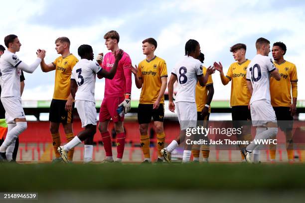 Players shake hands on the pitch ahead of the Premier League 2 match between Tottenham Hotspur and Wolverhampton Wanderers at The Lamex Stadium on...