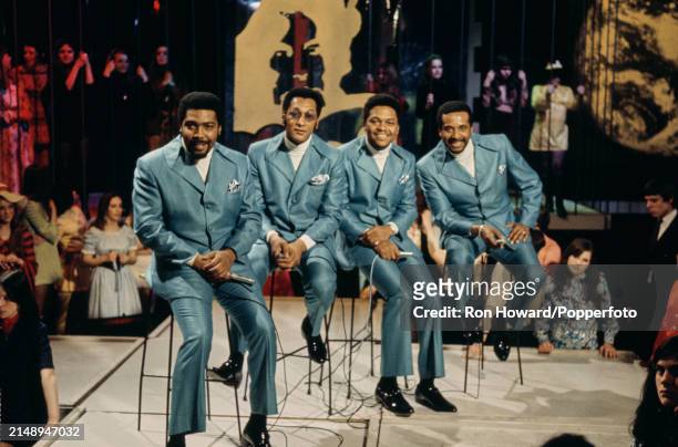 American vocal group Four Tops seated on stools surrounded by a studio audience on the set of a pop music television show in London circa 1970....