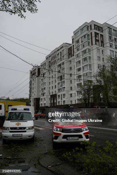 Cars of deminers parked in front of residential building damaged as result of missile attack on April 17, 2024 in Chernihiv, Ukraine. Russian forces...