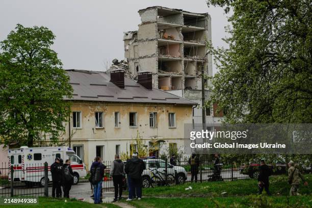Police members stand in front of object of social infrastructure destroyed as result of missile attack on April 17, 2024 in Chernihiv, Ukraine....
