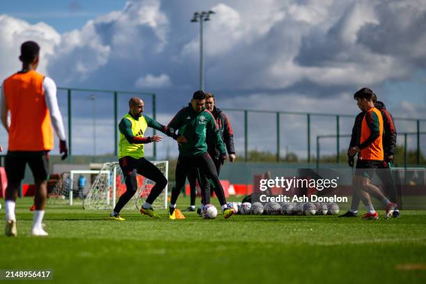 Sofyan Amrabat and Casemiro of Manchester United in action during a first team training session at Carrington Training Ground on April 16, 2024 in...