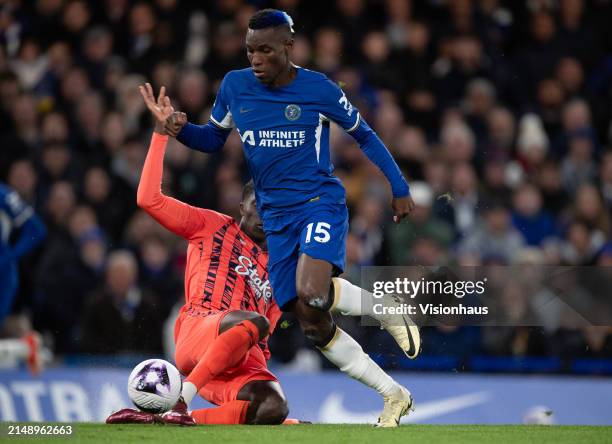 Nicolas Jackson of Chelsea skips past Amadou Onana of Everton during the Premier League match between Chelsea FC and Everton FC at Stamford Bridge on...