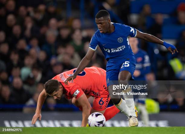 Moises Caicedo of Chelsea skips past James Tarkowski of Everton during the Premier League match between Chelsea FC and Everton FC at Stamford Bridge...