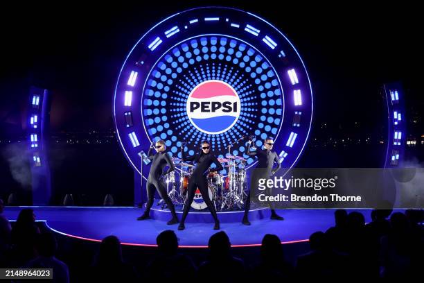 Models and dancers showcase designs by Jackson Cowden during the Pepsi 'Pulse Collection' Fashion Showcase at Overseas Passenger Terminal on April...