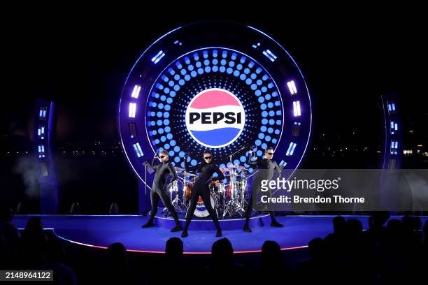 Models and dancers showcase designs by Jackson Cowden during the Pepsi 'Pulse Collection' Fashion Showcase at Overseas Passenger Terminal on April...
