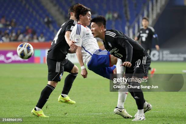 Hwang Seok-ho of Ulsan Hyundai is fouled by Ken Matsubara of Yokohama F.Marinos during the AFC Champions League semi final first leg match between...