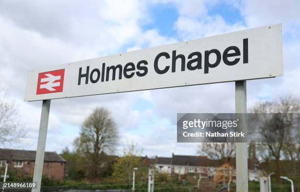 Holmes Chapel sign is displayed as Harry Styles fans visit Holmes Chapel Train Station on April 17, 2024 in Holmes Chapel, England. The Holmes Chapel...