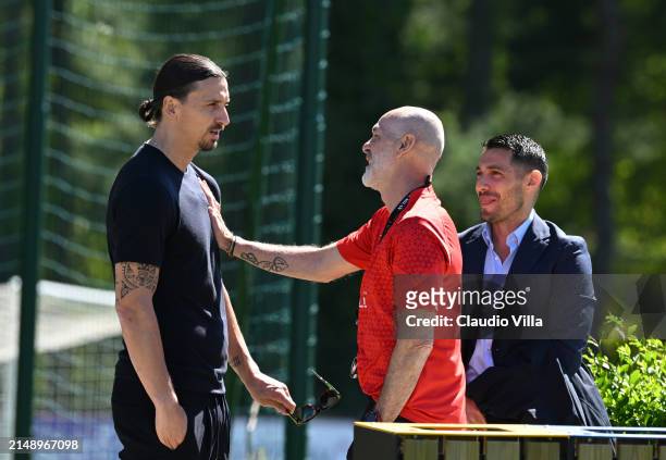 Milan head coach Stefano Pioli talks to Zlatan Ibrahimovic and Geoffrey Moncada during the UEFA Europa League 2023/24 quarter-final second leg...