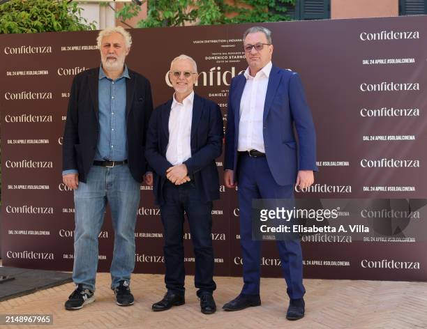 Screenwriter Francesco Piccolo, director Daniele Luchetti and producer Fabrizio Donvito attend the photocall for the movie "Confidenza" at Hotel De...