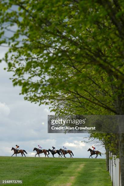 General view as runners ease down up the hill after finishing in The Weatherbys Global Stallions App Handicap at Newmarket Racecourse on April 17,...