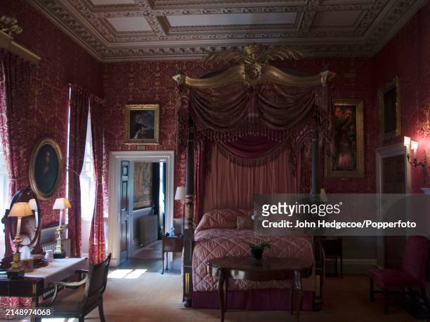 View of a refurbished and restored bedroom in Holkham Hall, a country house and seat of the Earls of Leicester, near the village of Holkham in...
