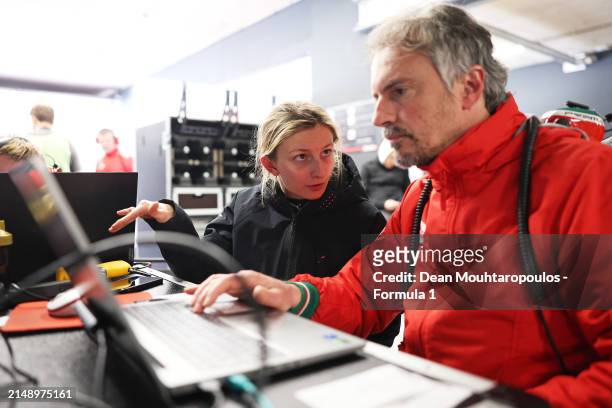 Doriane Pin of France and PREMA Racing studies data with a PREMA Racing team member during F1 Academy Testing at Circuit Zandvoort on April 17, 2024...