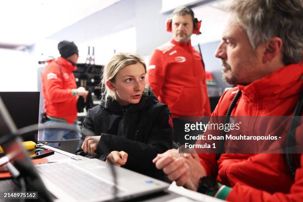 Doriane Pin of France and PREMA Racing studies data with a PREMA Racing team member during F1 Academy Testing at Circuit Zandvoort on April 17, 2024...