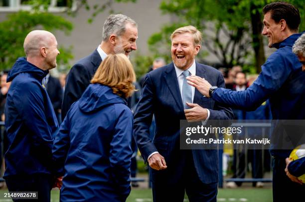 King Willem-Alexander of The Netherlands and King Felipe of Spain visit a Cruyff sports court on April 17, 2024 in Amsterdam, Netherlands. The...