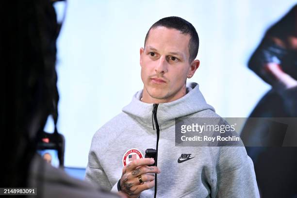 Nick Mayhugh speaks to press as U.S.A. Olympians and Paralympians Light the Empire State Building to Mark 100 Days Out from the Olympics at The...