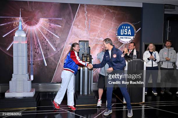 Daniela Moroz and Matthew Stutzman flip the switch as U.S.A. Olympians and Paralympians Light the Empire State Building to Mark 100 Days Out from the...