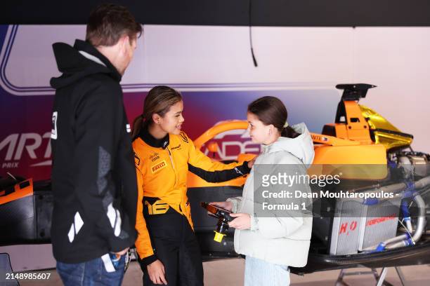 Bianca Bustamante of Philippines and ART Grand Prix talks with a guest in the garage during F1 Academy Testing at Circuit Zandvoort on April 17, 2024...