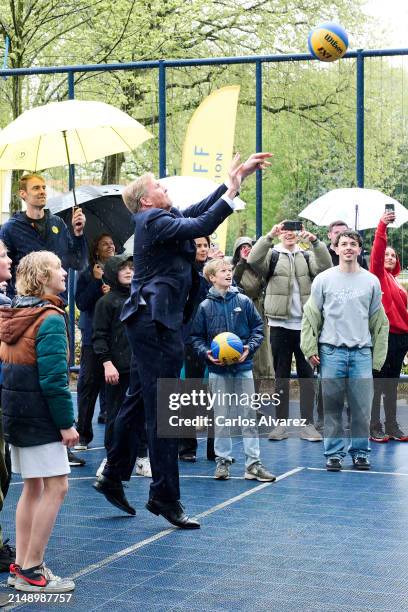 King Willem-Alexander of the Netherlands throws a basketball during his visit whit King Felipe of Spain to the Johan Cruyff Foundation for children...