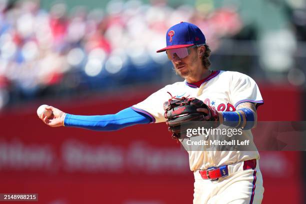 Bryson Stott of the Philadelphia Phillies throws the ball to first against the Pittsburgh Pirates at Citizens Bank Park on April 14, 2024 in...