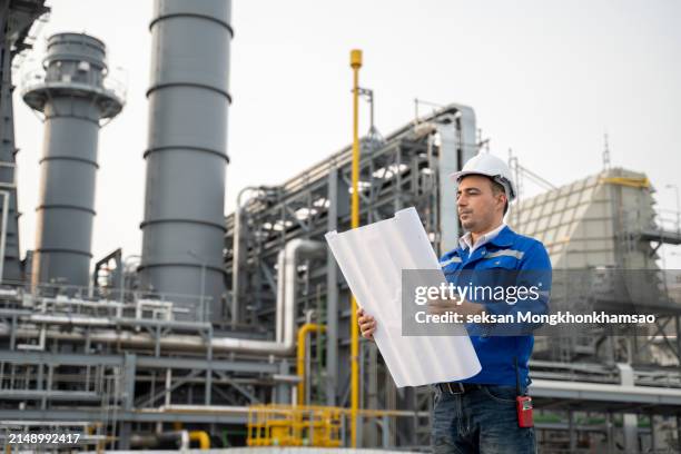 service engineer is working at gas turbine electric power plant - gas turbine electrical power plant stock pictures, royalty-free photos & images