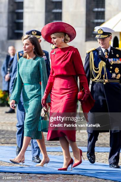 Queen Maxima of The Netherlands welcomes Queen Letizia of Spain with an official welcome ceremony at the Royal Palace on April 17, 2024 in Amsterdam,...