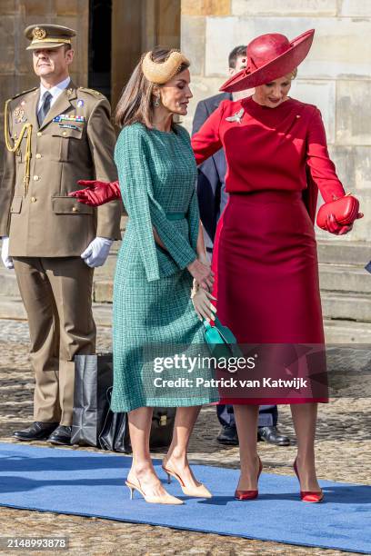 Queen Maxima of The Netherlands welcomes Queen Letizia of Spain with an official welcome ceremony at the Royal Palace on April 17, 2024 in Amsterdam,...